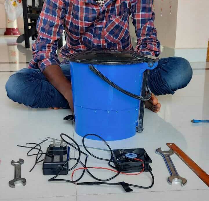 DIY cooling mechanism to maintain the freshness of vegetables using a plastic box, fan, iron grill, and a pvc pipe